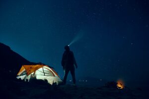 man camping at night