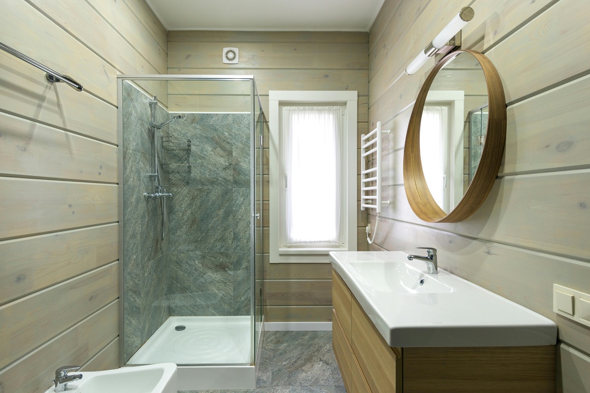 bathroom with shower wall panels