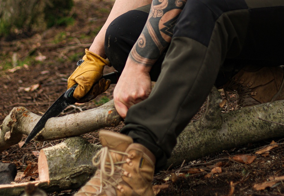man using silky saw
